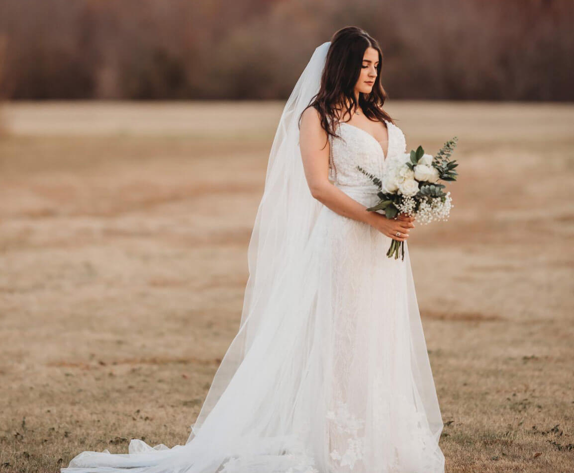 Model wearing a white gown