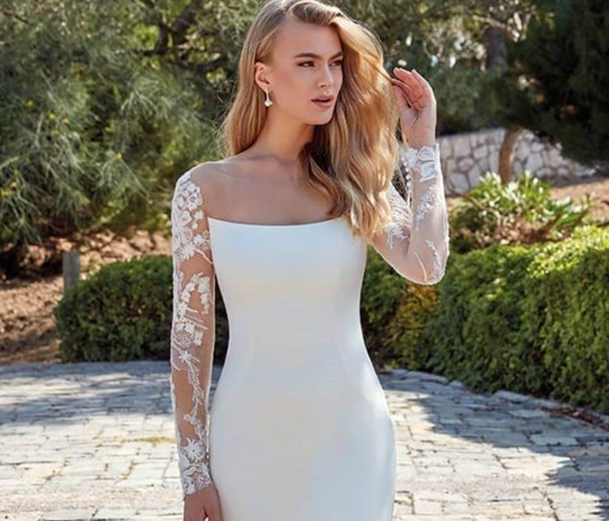 Model wearing a white gown by eddy k. Mobile image