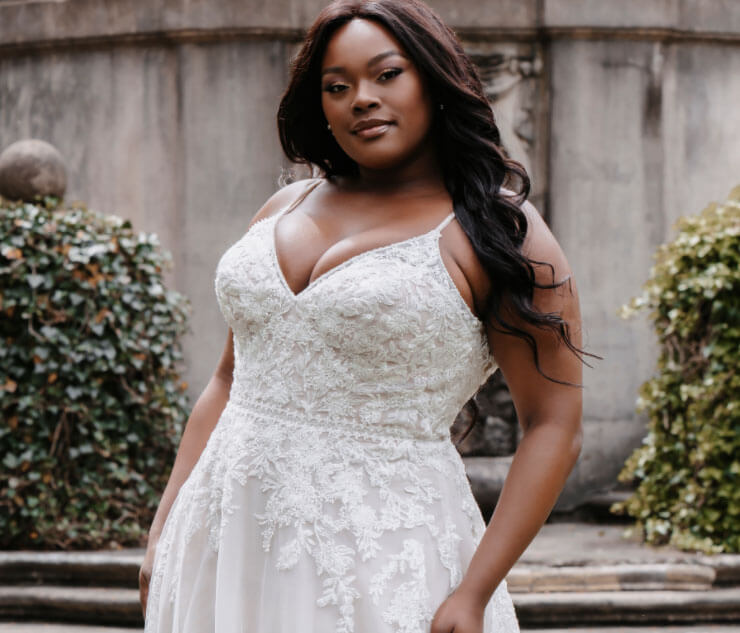 Model wearing a white gown by allure bridals