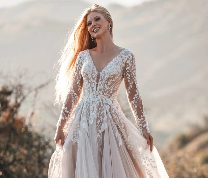 Model wearing a gown by Allure Romance.