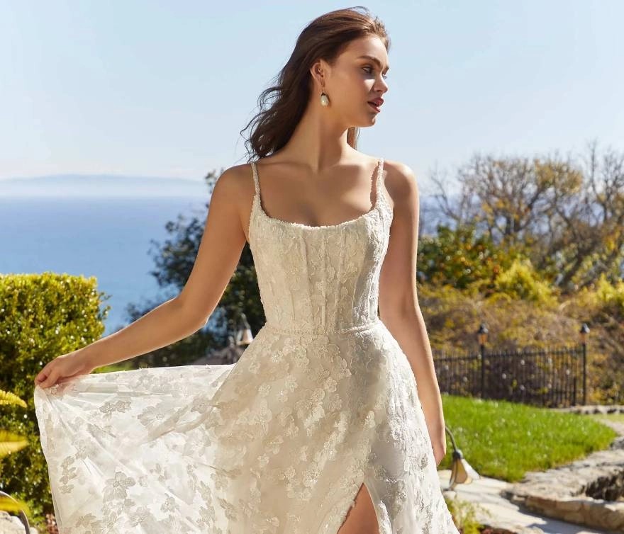 Model wearing a gown by Blu by Morilee.