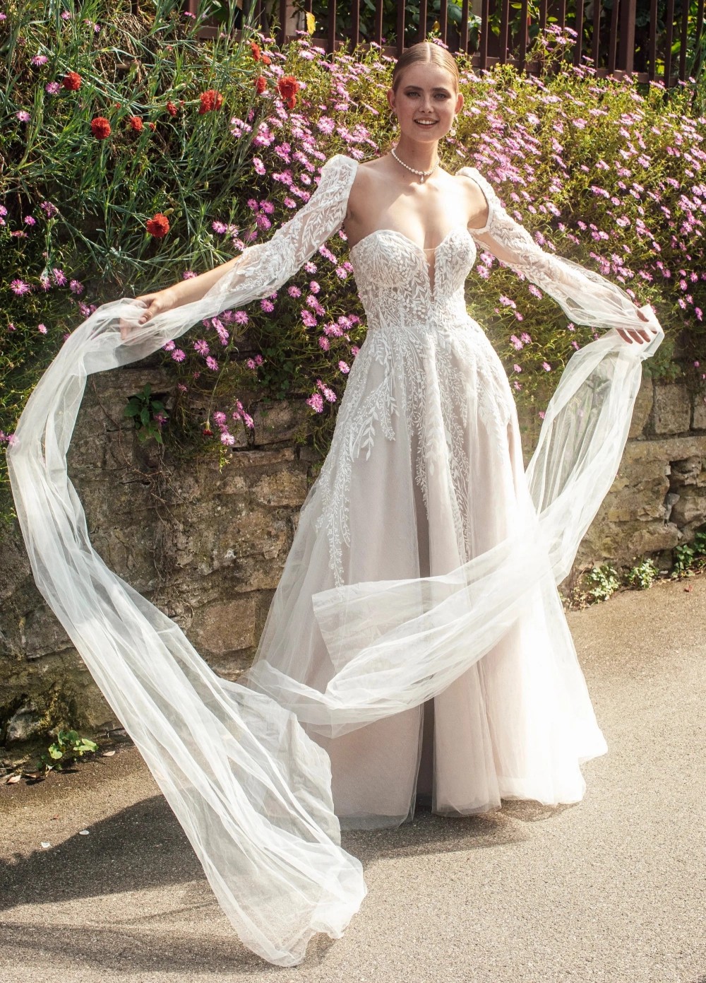 Model wearing a gown by Madison James.