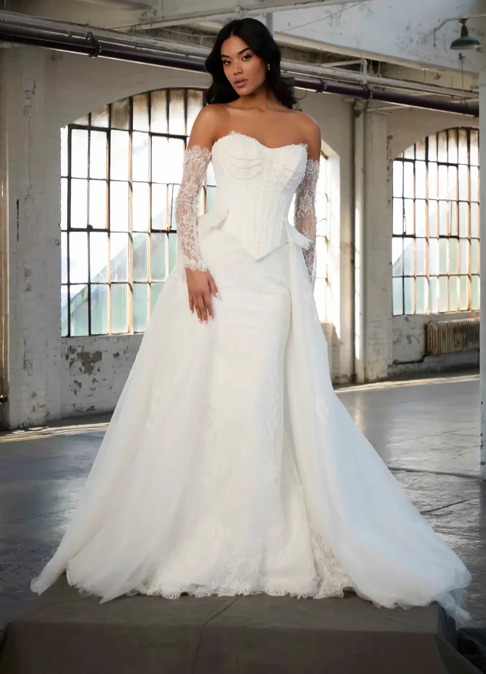 Model wearing a gown by Madison James.